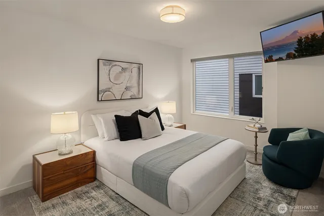 a bedroom with bed and window