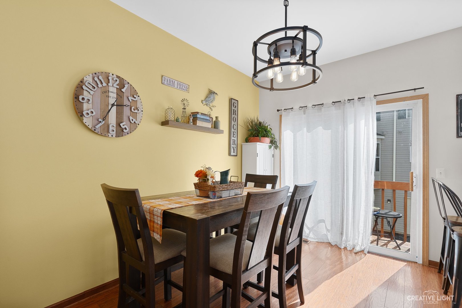 1805 Grandview Place Montgomery, IL 60538 - Photo 5 of 14 a view of a dining room with furniture wooden floor and a chandelier