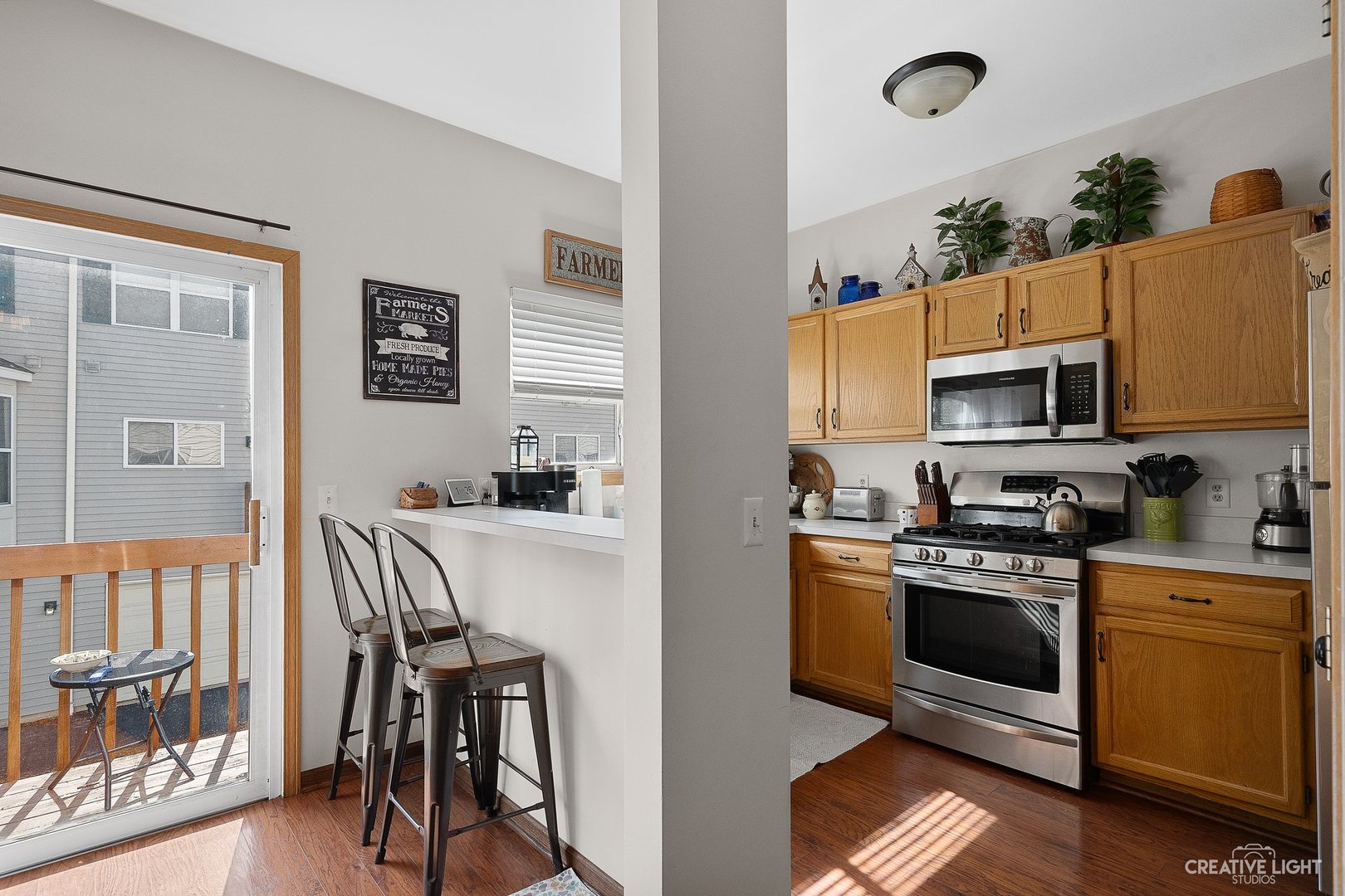 1805 Grandview Place Montgomery, IL 60538 - Photo 6 of 14 a kitchen with stainless steel appliances granite countertop a stove top oven a sink and a refrigerator