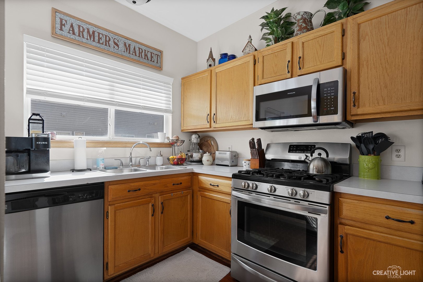 1805 Grandview Place Montgomery, IL 60538 - Photo 7 of 14 a kitchen with stainless steel appliances granite countertop a sink stove and microwave
