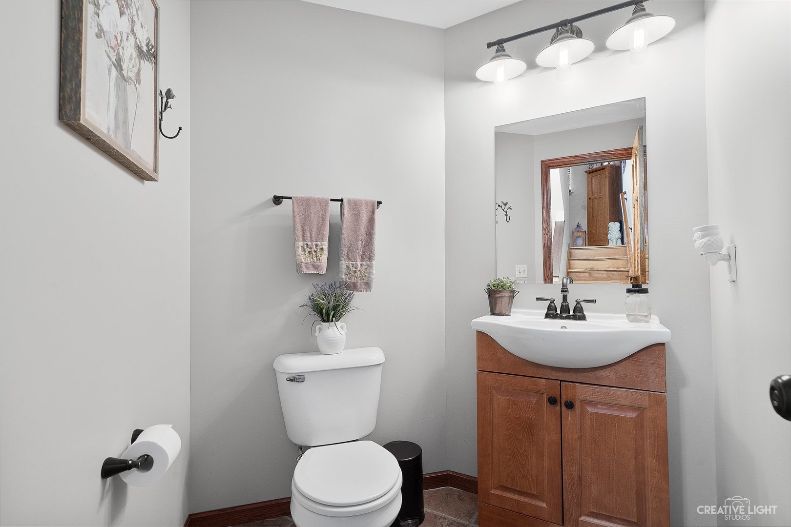 1805 Grandview Place Montgomery, IL 60538 - Photo 8 of 14 a bathroom with a toilet sink and mirror