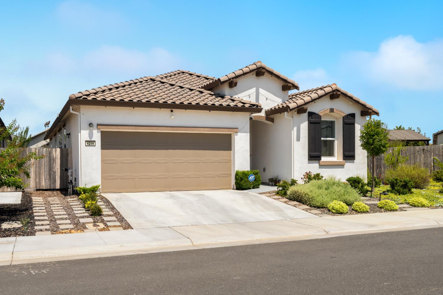 4216 Creede Way Rancho Cordova, CA 95742 - Photo 4 of 56 a front view of a house with a yard and garage