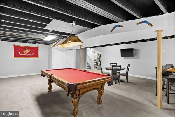 a aerial view of a house with a big yard and large trees