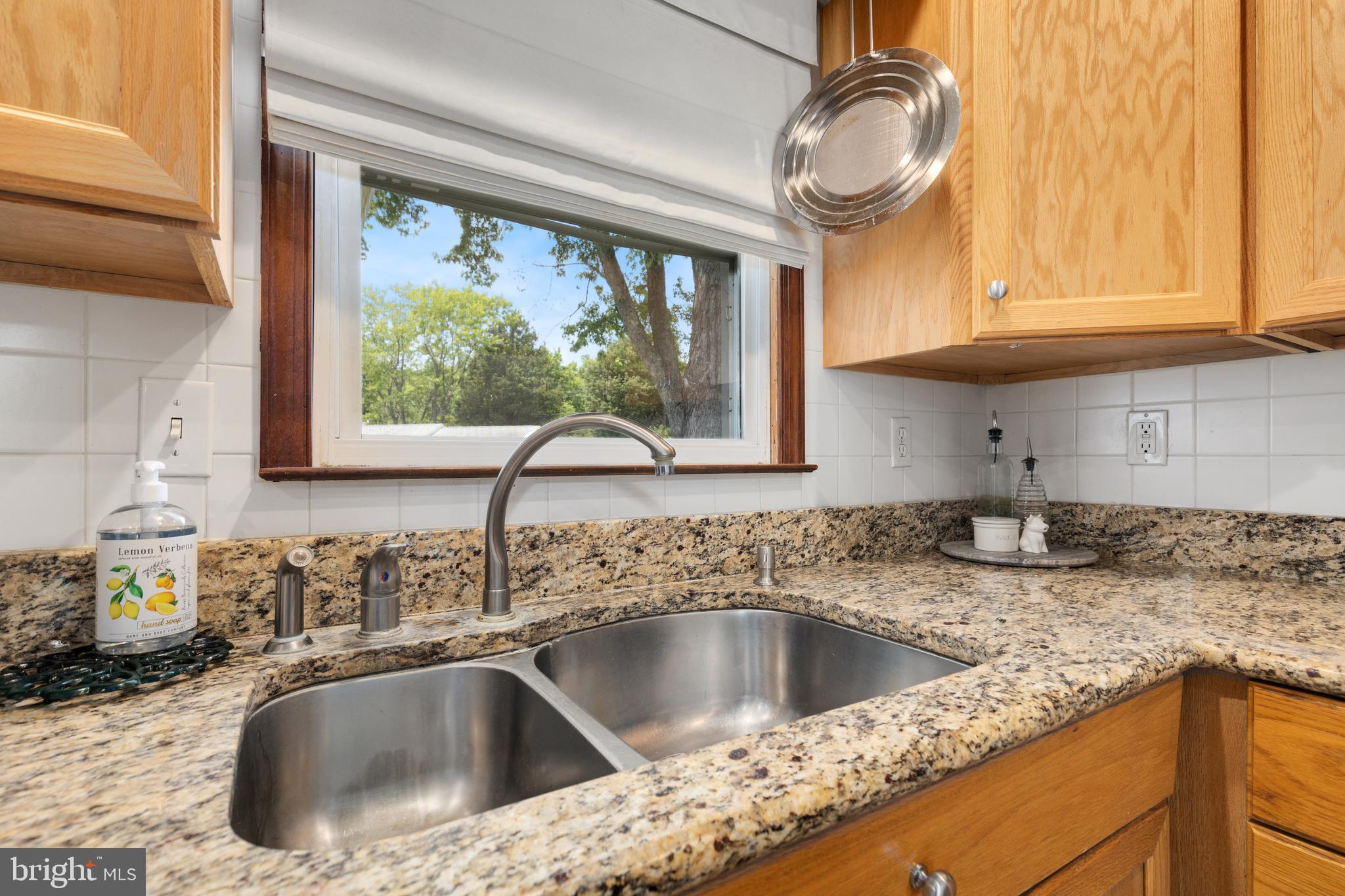 133 Valley View Avenue Edgewater, MD 21037 - Photo 10 of 41 a kitchen with granite countertop a sink and a window
