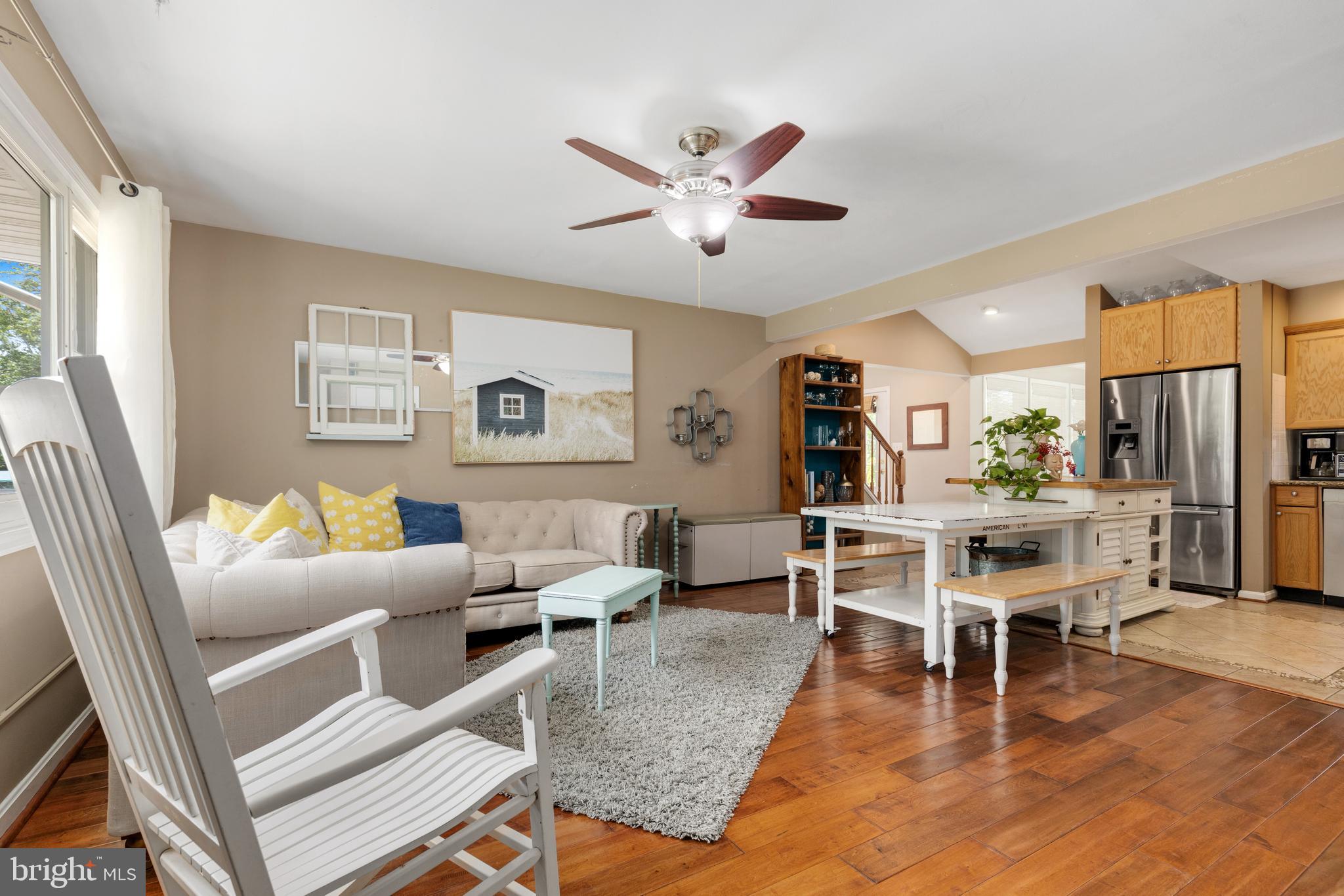 133 Valley View Avenue Edgewater, MD 21037 - Photo 15 of 41 a living room with furniture a large window and wooden floor