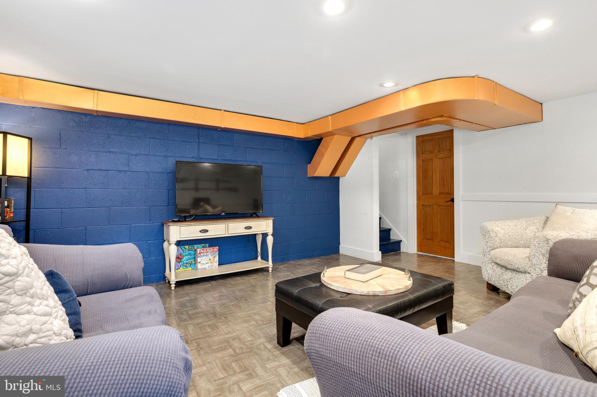 133 Valley View Avenue Edgewater, MD 21037 - Photo 17 of 41 a living room with furniture and a flat screen tv