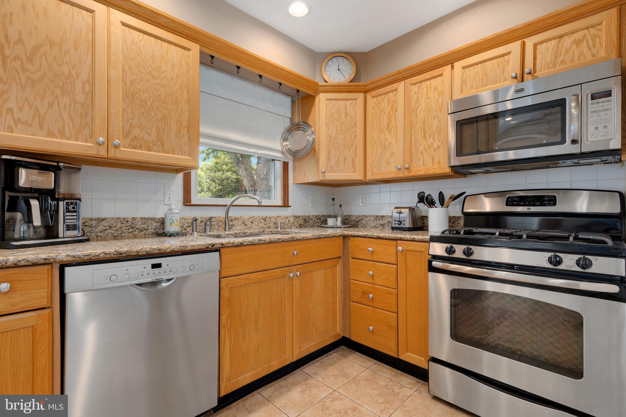 133 Valley View Avenue Edgewater, MD 21037 - Photo 2 of 41 a kitchen with stainless steel appliances granite countertop a stove microwave and sink