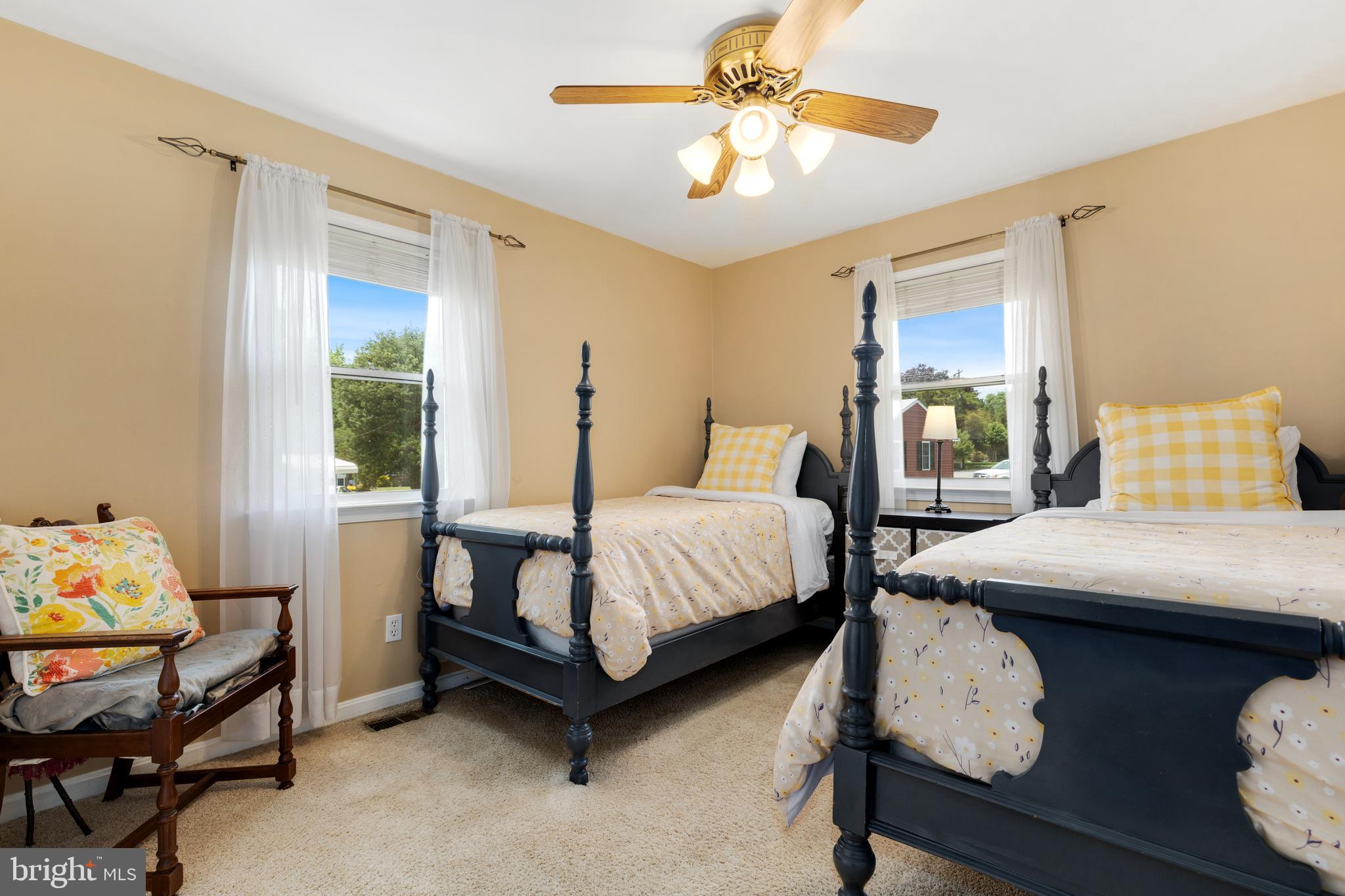 133 Valley View Avenue Edgewater, MD 21037 - Photo 30 of 41 a bedroom with a bed and a chandelier