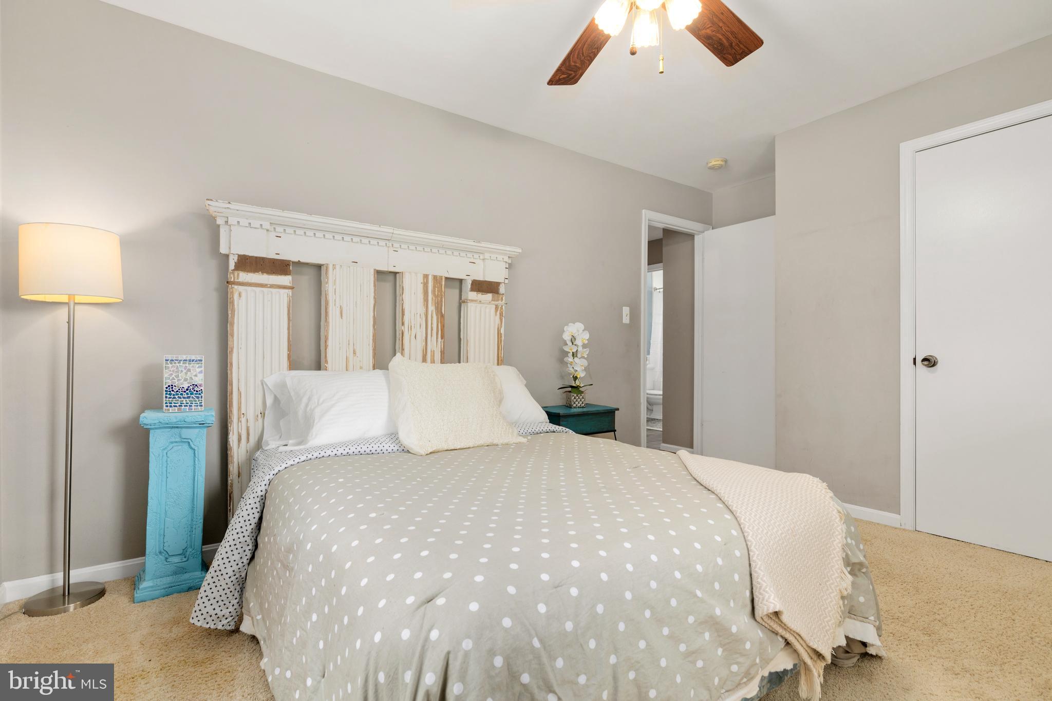 133 Valley View Avenue Edgewater, MD 21037 - Photo 33 of 41 a bed room with a bed and a chandelier