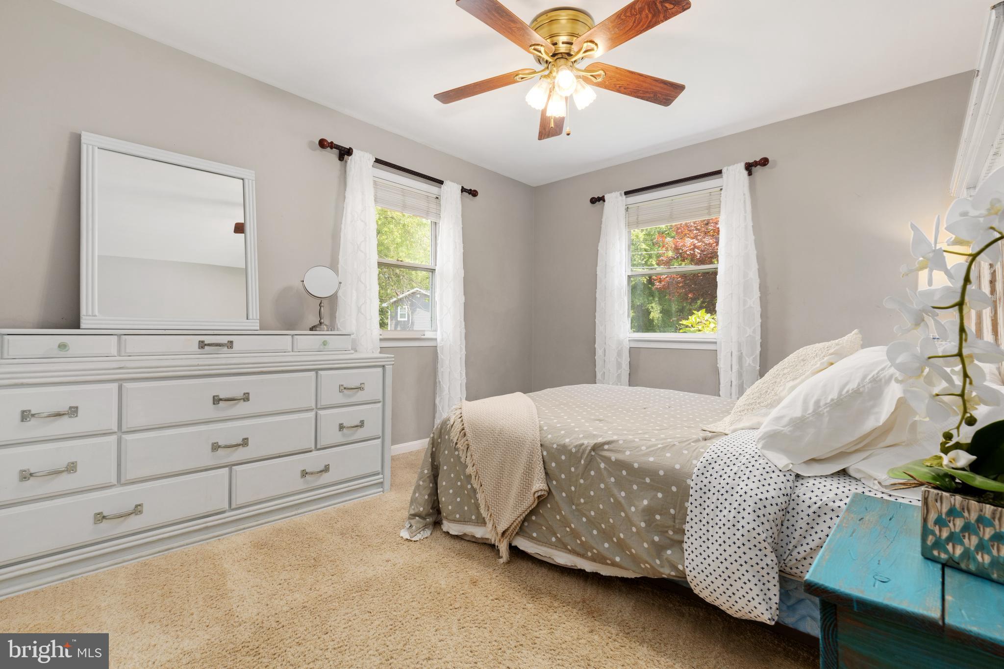 133 Valley View Avenue Edgewater, MD 21037 - Photo 35 of 41 a bedroom with a bed and a chandelier