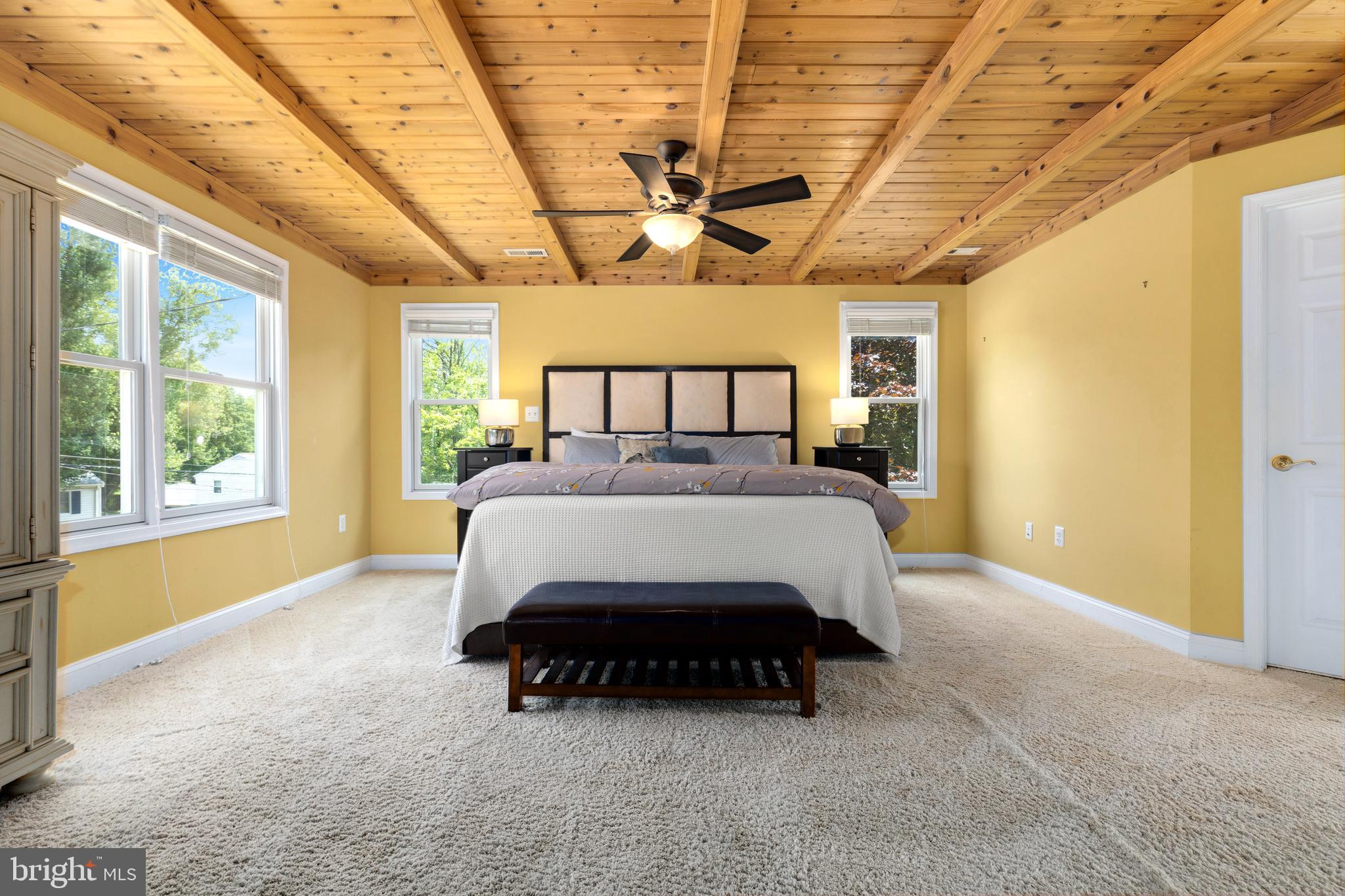 133 Valley View Avenue Edgewater, MD 21037 - Photo 4 of 41 a bed sitting in a spacious bedroom next to a window