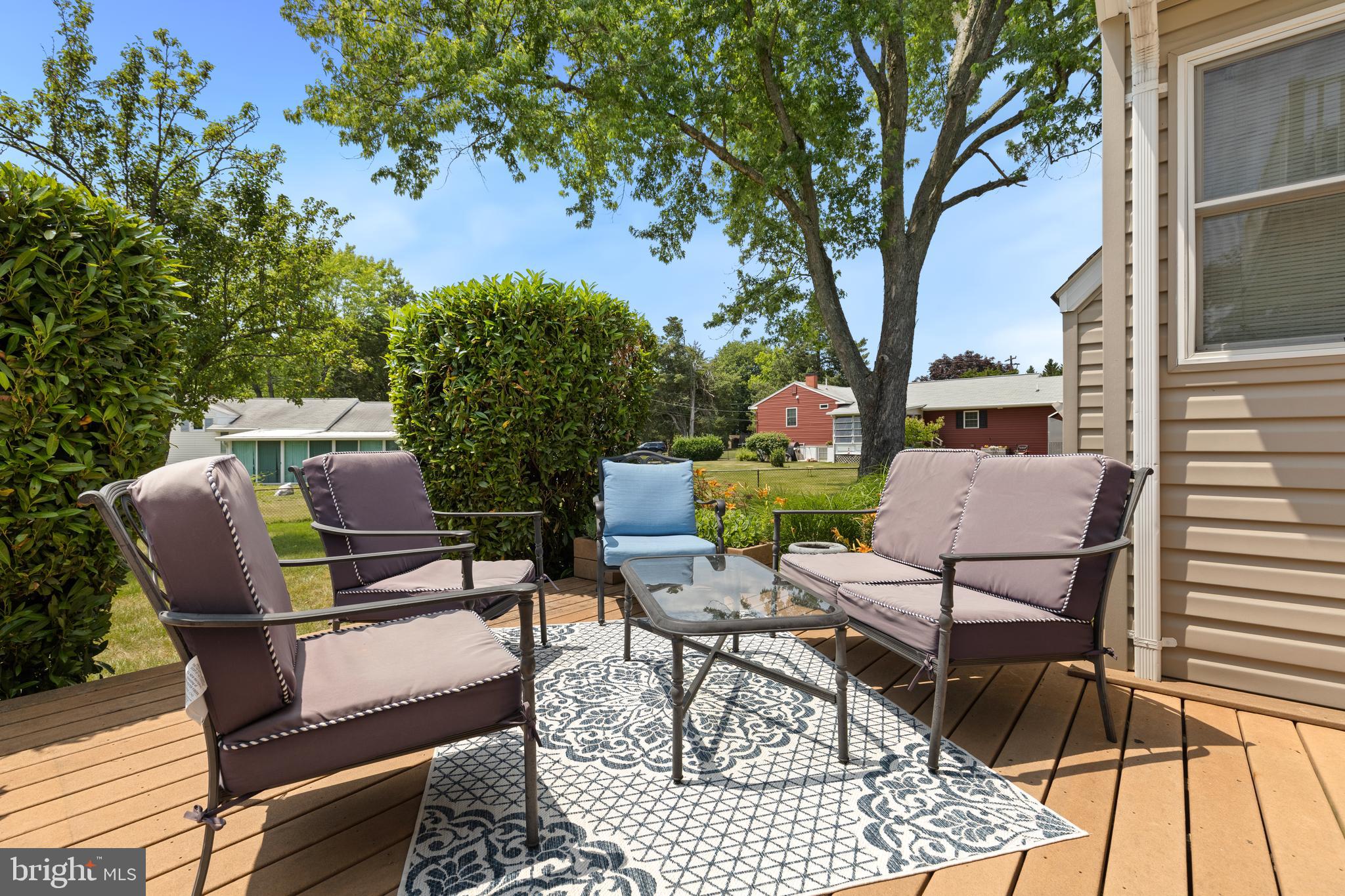 133 Valley View Avenue Edgewater, MD 21037 - Photo 9 of 41 a view of a patio with a dining table and chairs with wooden floor and fence