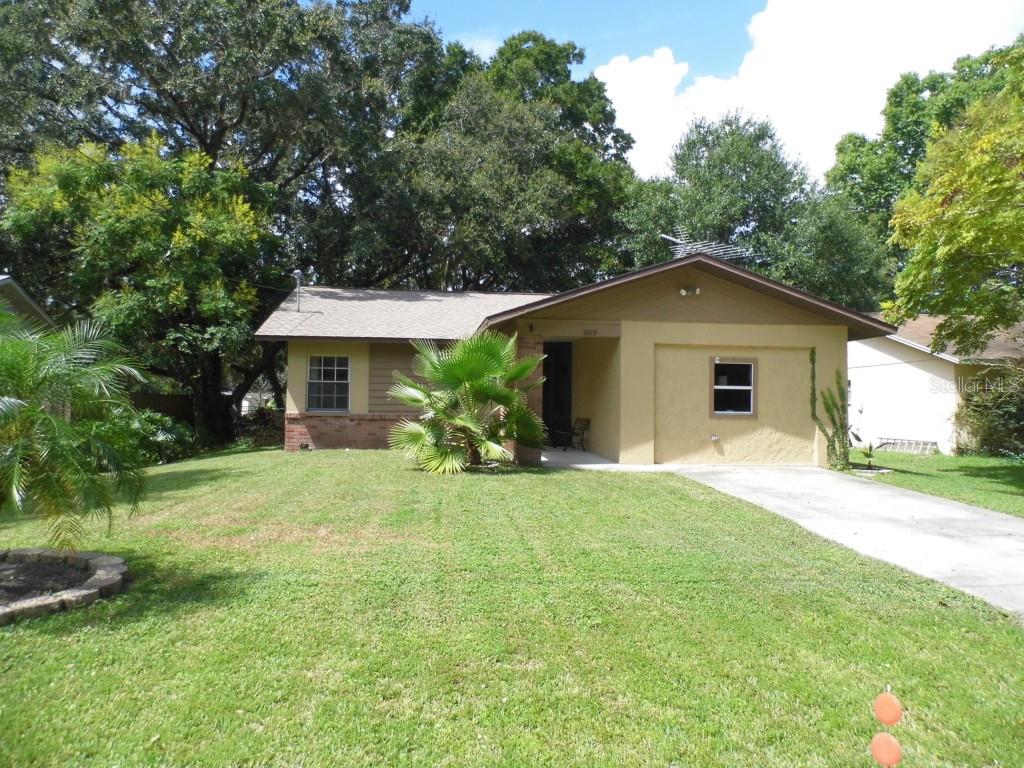 6819 Stell Drive New Port Richey, FL 34653 - Photo 1 of 1 a front view of a house with a yard