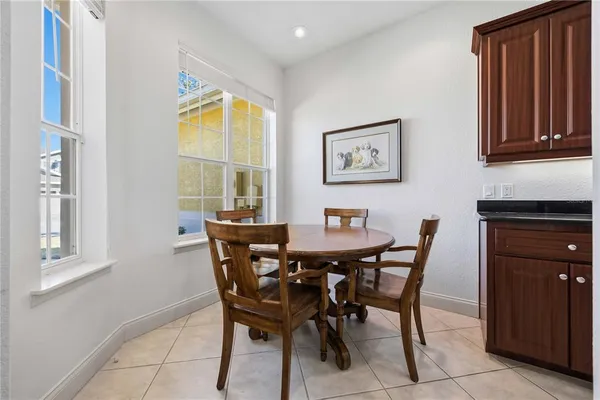a view of a dining room with furniture and a window
