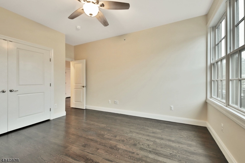 115 Watchung Avenue, Unit 1 Montclair, NJ 07043 - Photo 13 of 15 wooden floor in an empty room with a window
