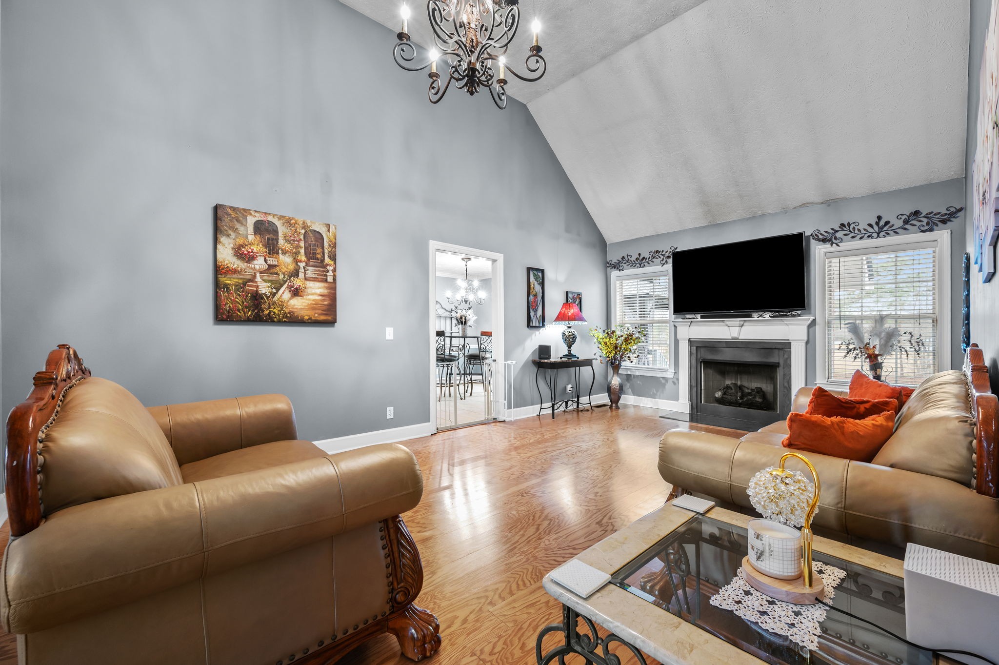 201 Oak Hollow Road Manchester, TN 37355 - Photo 12 of 43 a living room with furniture a fireplace and a flat screen tv