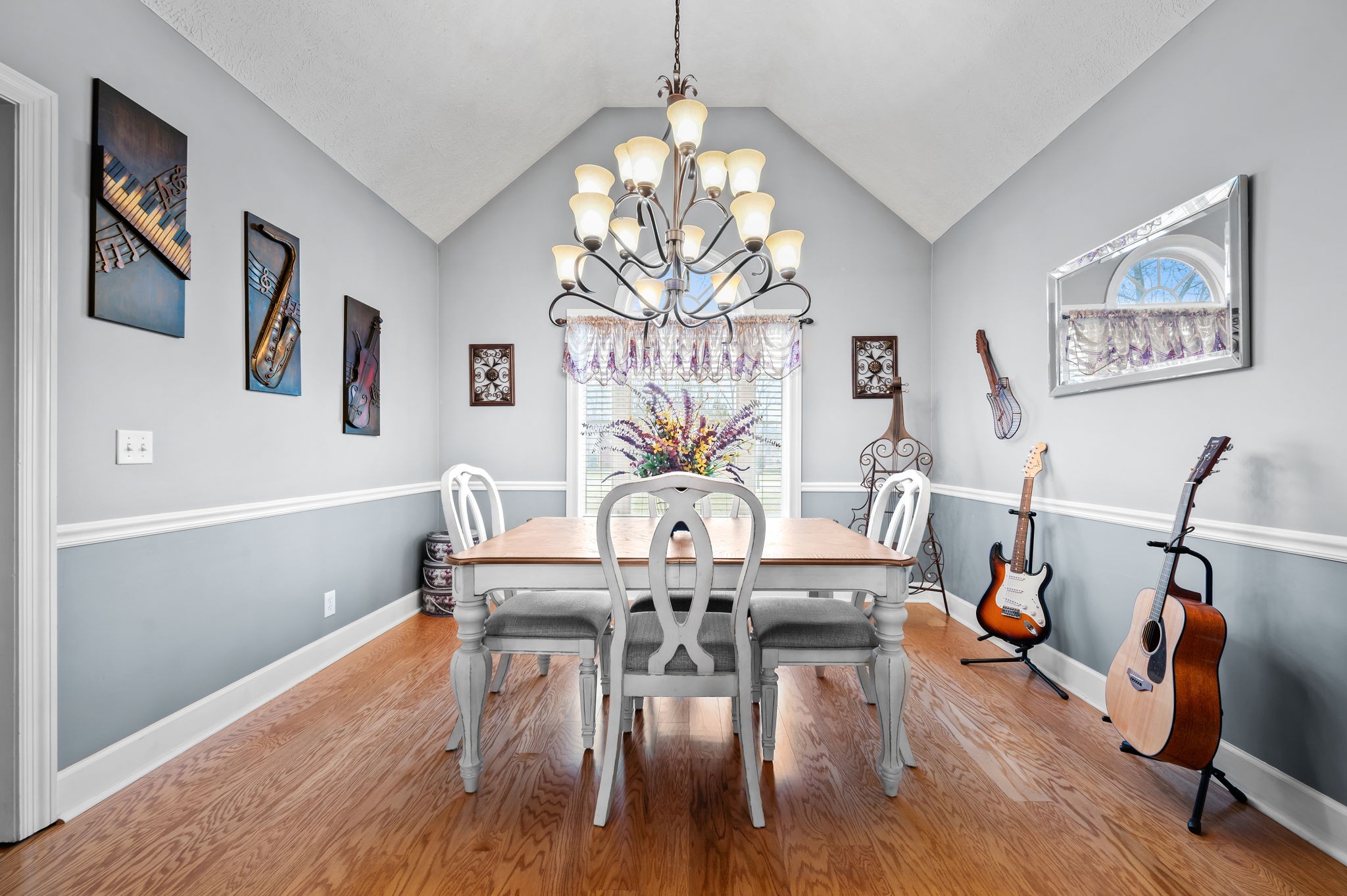 201 Oak Hollow Road Manchester, TN 37355 - Photo 15 of 43 a view of a dining room with furniture wooden floor and chandelier