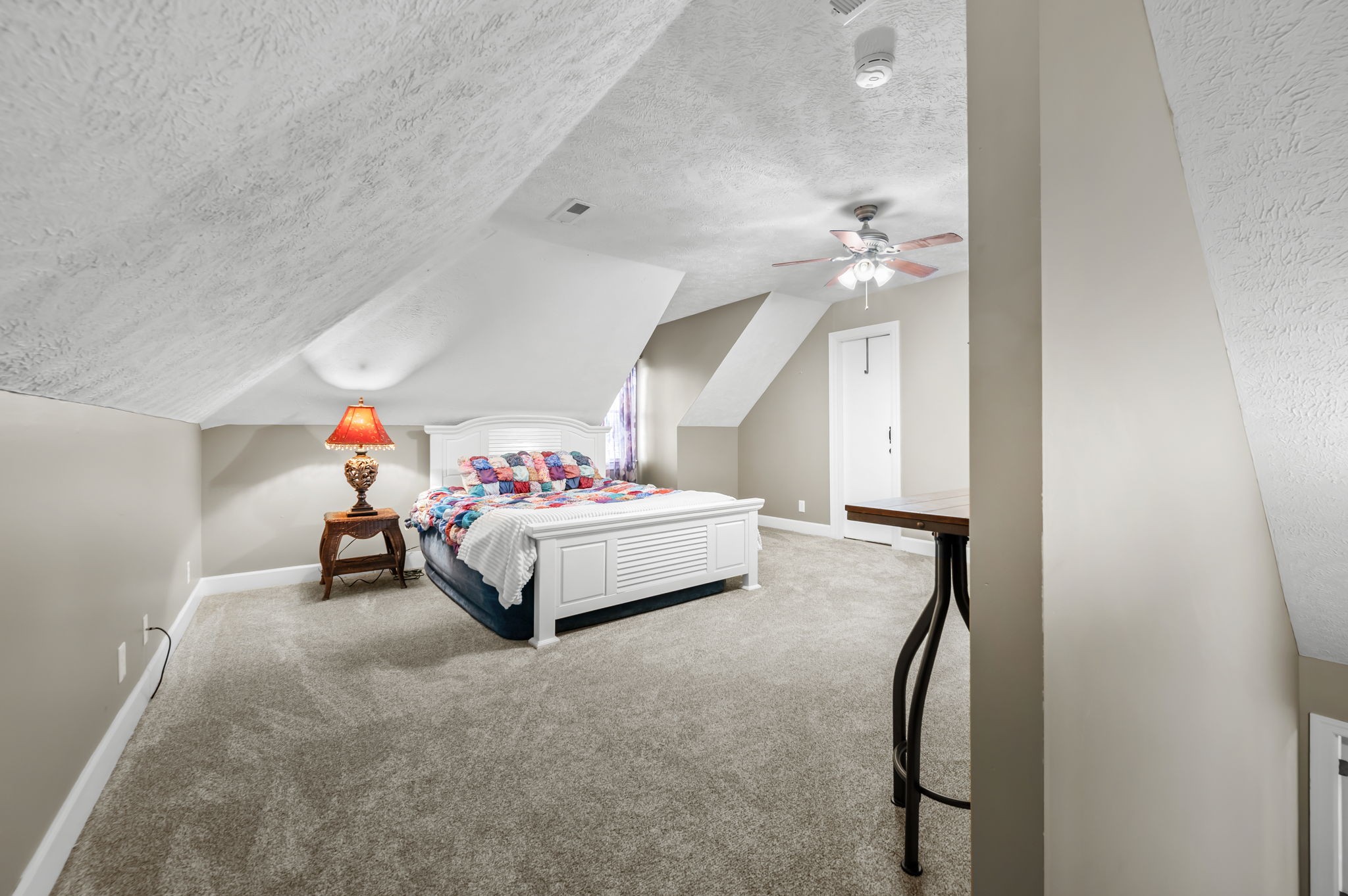 201 Oak Hollow Road Manchester, TN 37355 - Photo 27 of 43 a bedroom with a bed and a chandelier