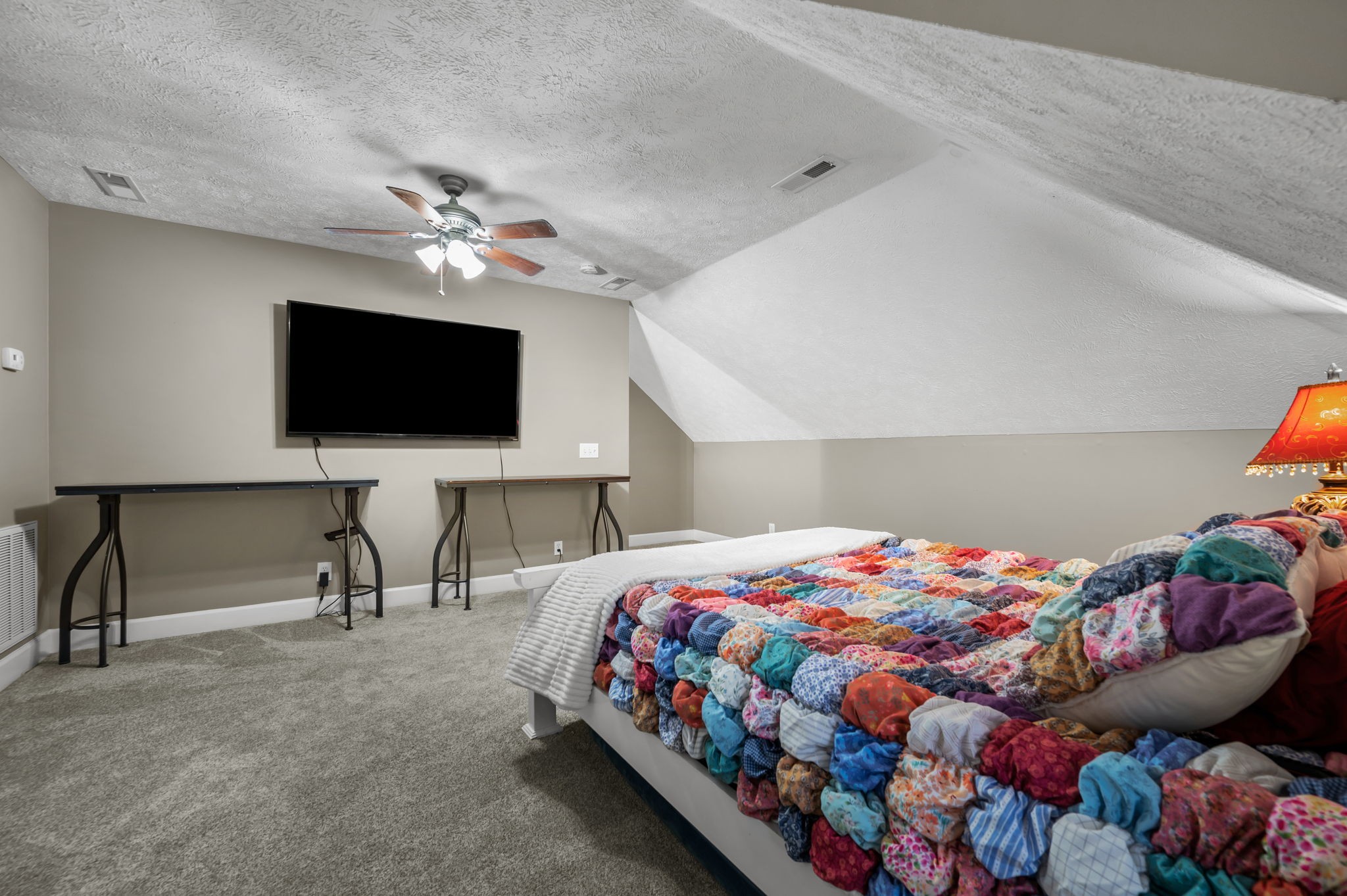 201 Oak Hollow Road Manchester, TN 37355 - Photo 29 of 43 a bedroom with a bed and a flat screen tv