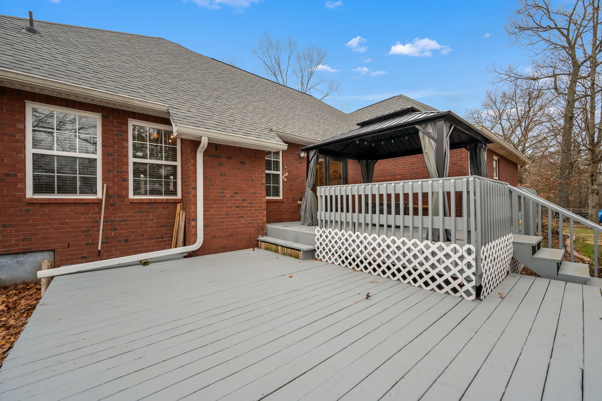201 Oak Hollow Road Manchester, TN 37355 - Photo 32 of 43 a view of a house with wooden deck and furniture