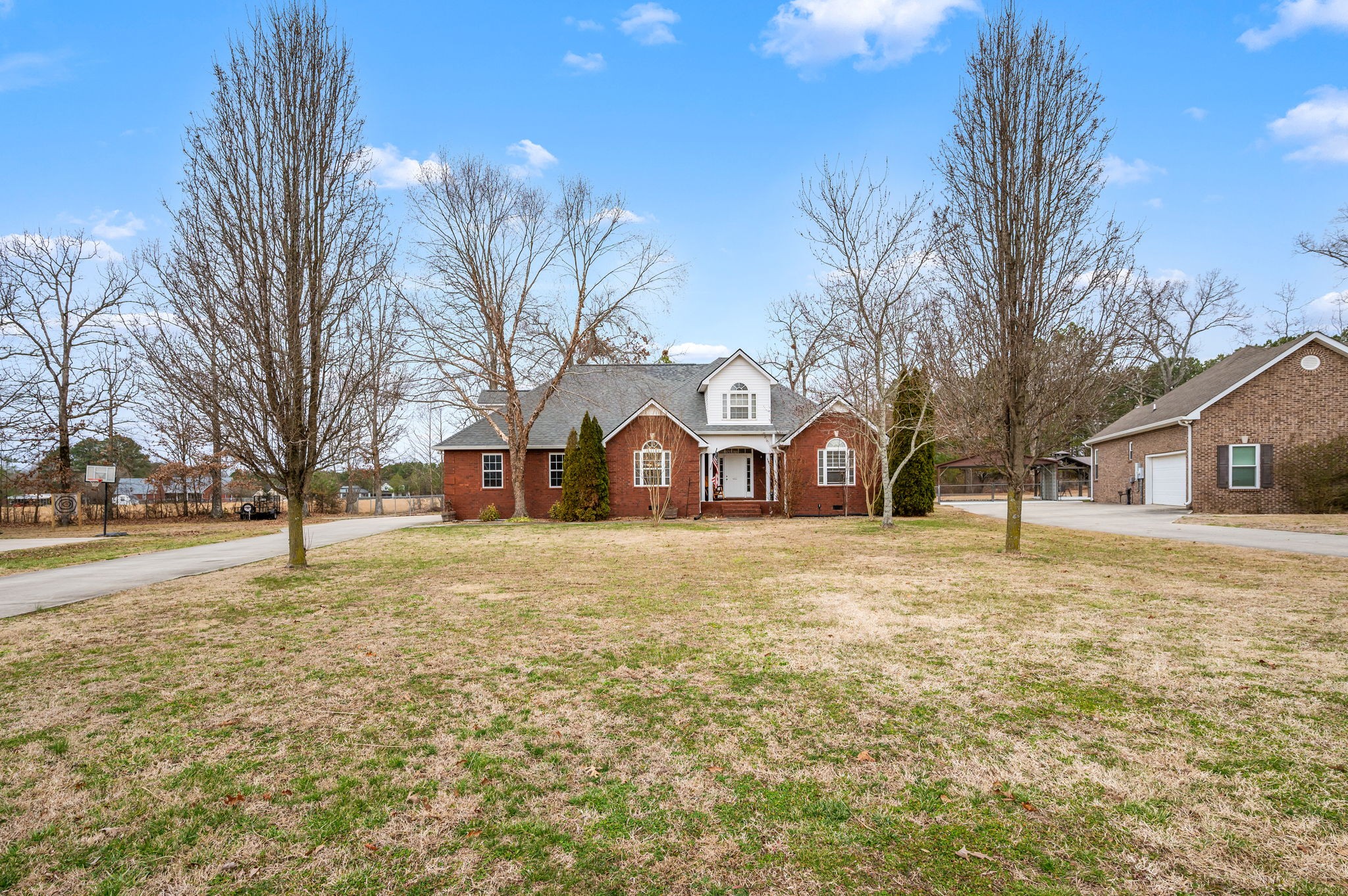 201 Oak Hollow Road Manchester, TN 37355 - Photo 37 of 43 a yellow house covered with snow in front of it