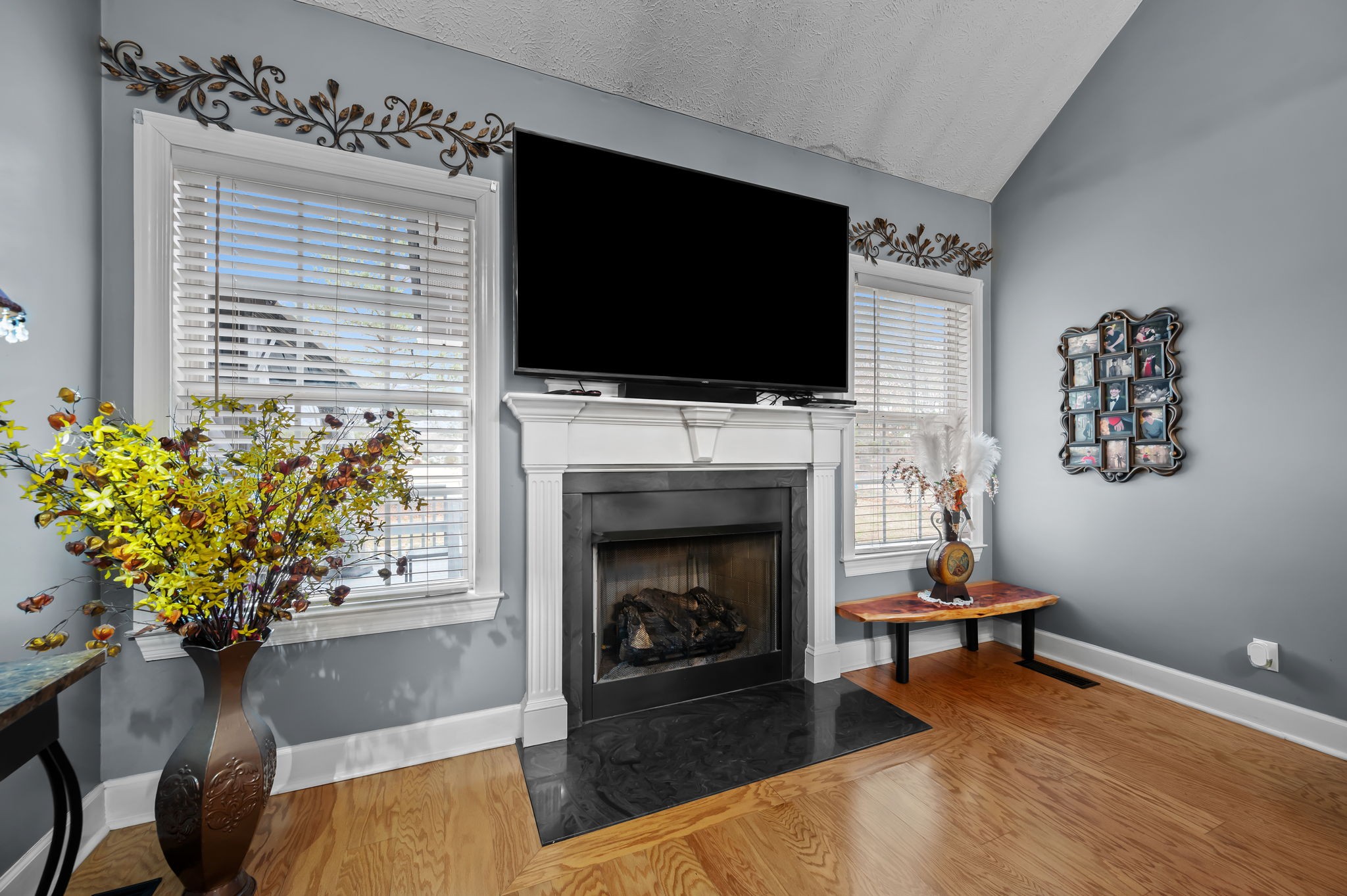 201 Oak Hollow Road Manchester, TN 37355 - Photo 5 of 43 a living room with furniture a flat screen tv and a fireplace