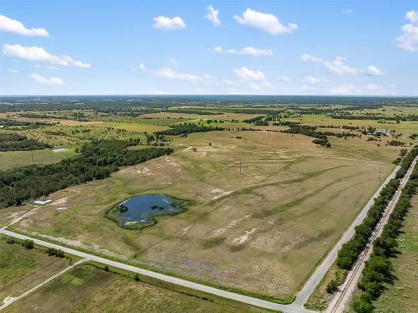 a view of a lake with a yard