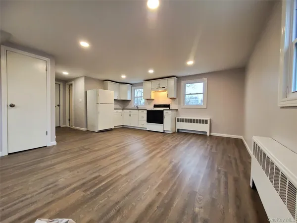 a view of kitchen and wooden floor