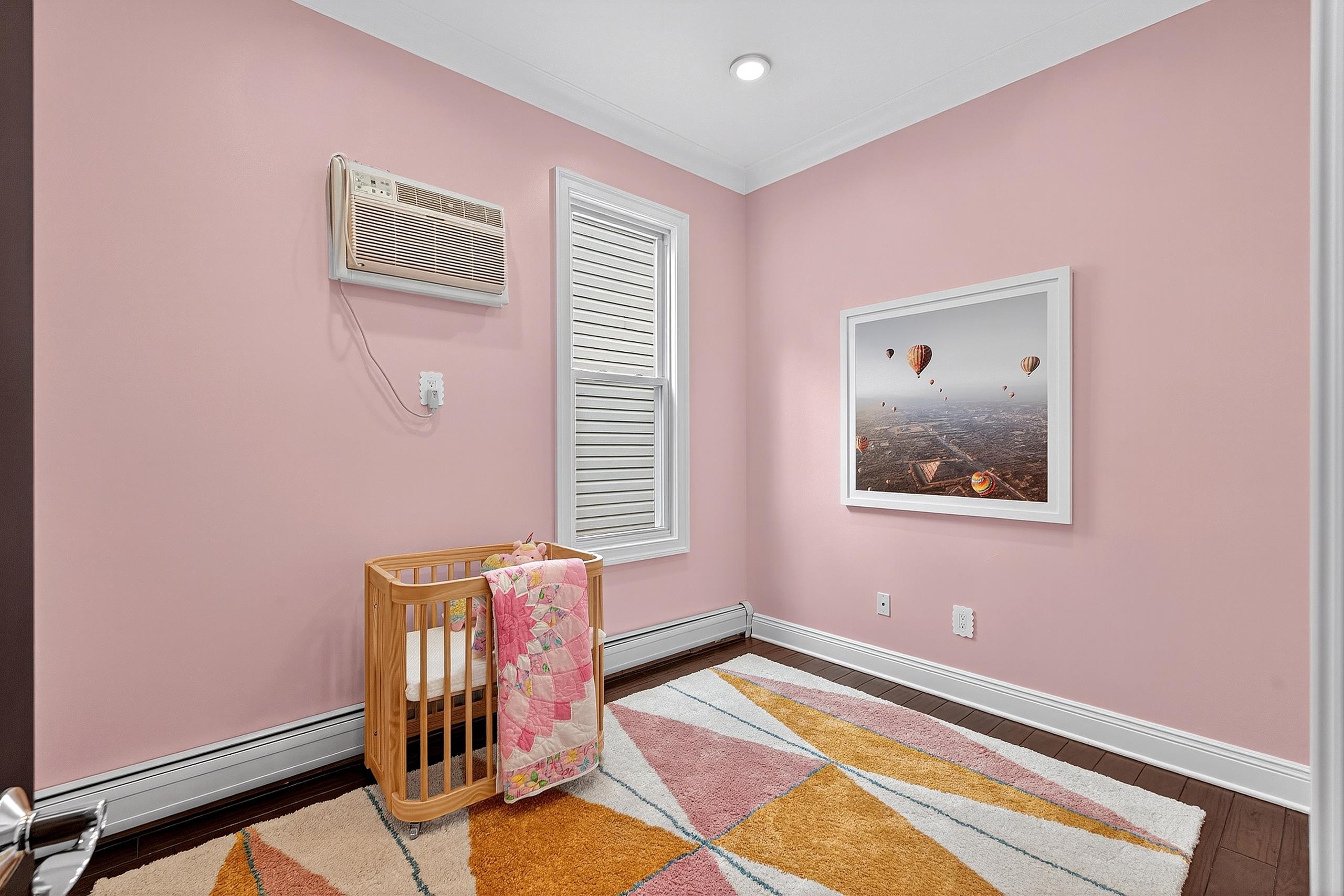 129 Prospect Street, Unit 3 Jersey City, NJ 07307 - Photo 18 of 34 a view of an empty room with window and flowerpot