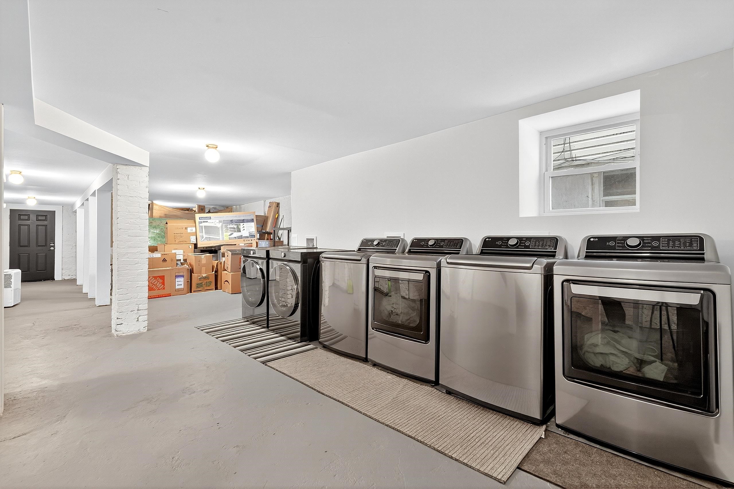 129 Prospect Street, Unit 3 Jersey City, NJ 07307 - Photo 23 of 34 a kitchen with stainless steel appliances granite countertop a stove a sink and a refrigerator
