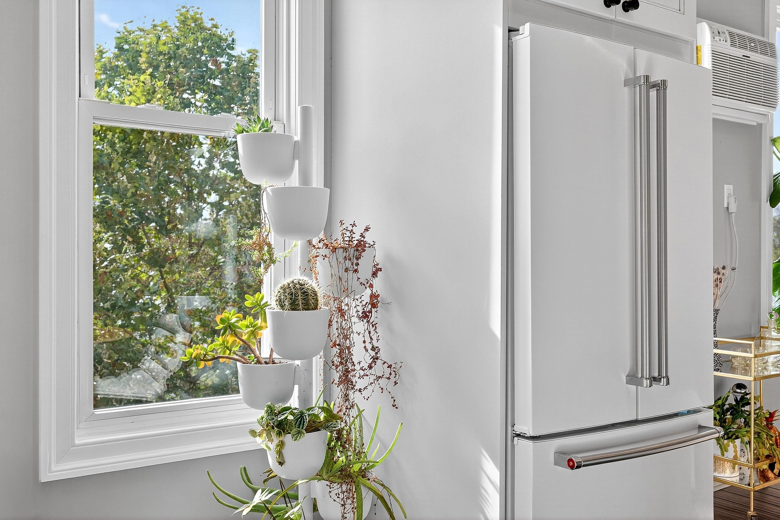 129 Prospect Street, Unit 3 Jersey City, NJ 07307 - Photo 6 of 34 a white painted wall with window and the shower
