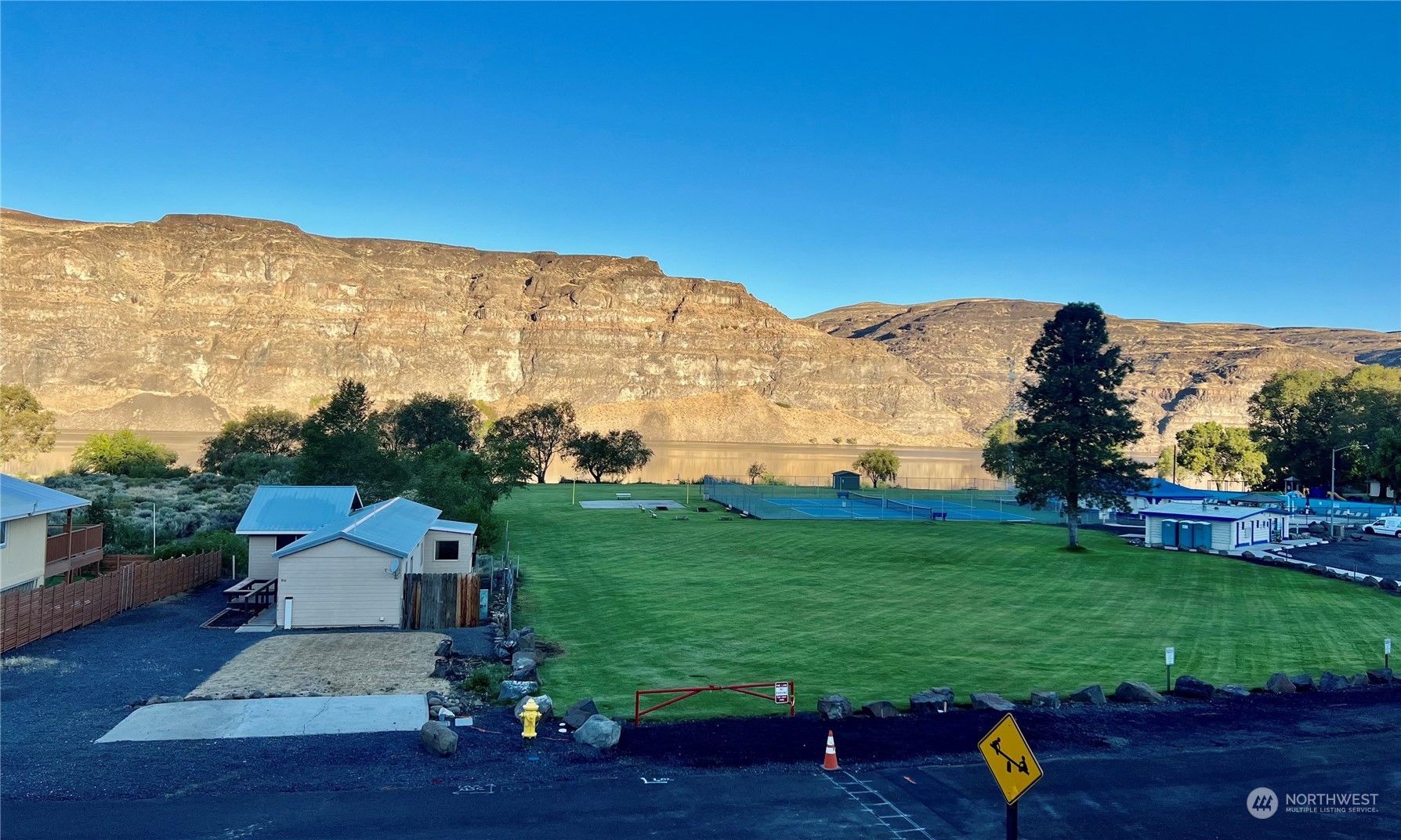 910 River Drive Quincy, WA 98848 - Photo 15 of 15 a view of a garden with mountains in the background