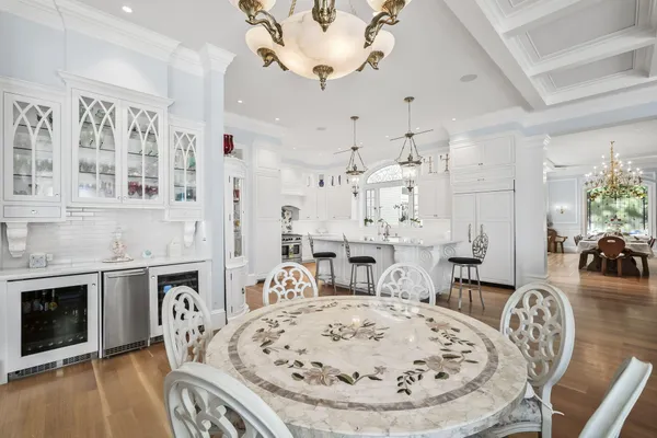 a spacious bedroom with a large bed and a fireplace