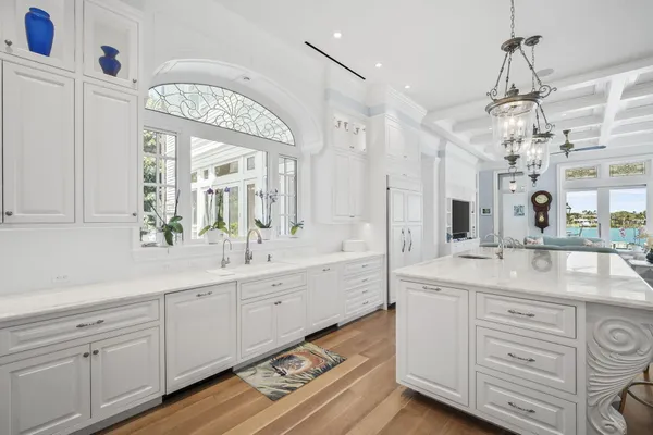 a bathroom with a granite countertop toilet sink mirror and vanity