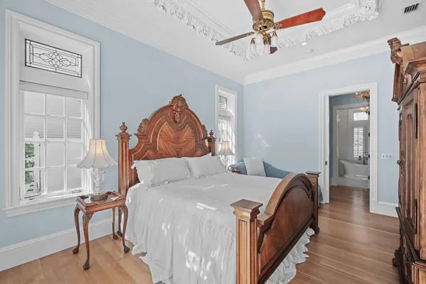 a bathroom with a granite countertop double vanity sink and a mirror