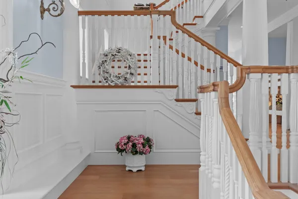 a view of a swimming pool with a lake and trees in front of it