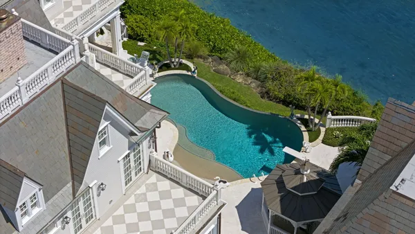 a view of a dining room with furniture wooden floor and chandelier