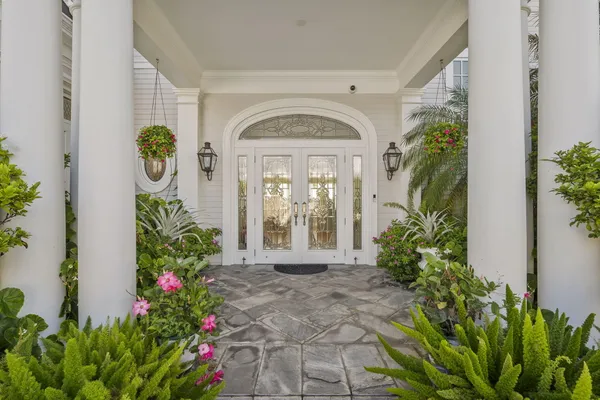 a living room with furniture kitchen view and a flat screen tv