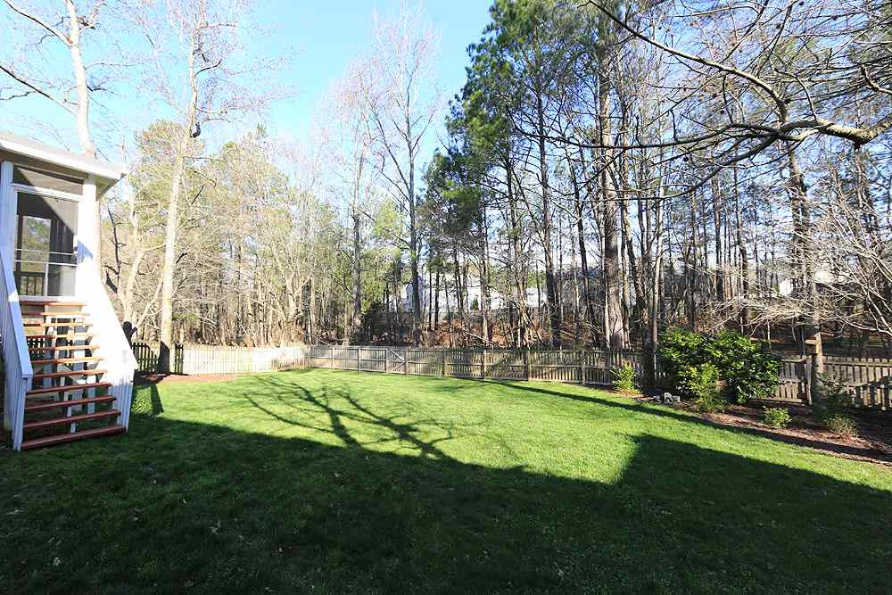 5628 Raddington Street Raleigh, NC 27613 - Photo 24 of 25 Fenced in yard adjoining to HOA greenway. Backyard