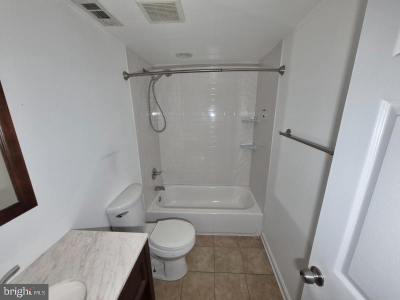 215 Sycamore Road Glen Burnie, MD 21060 - Photo 15 of 16 Modern bathroom with sleek finishes.
