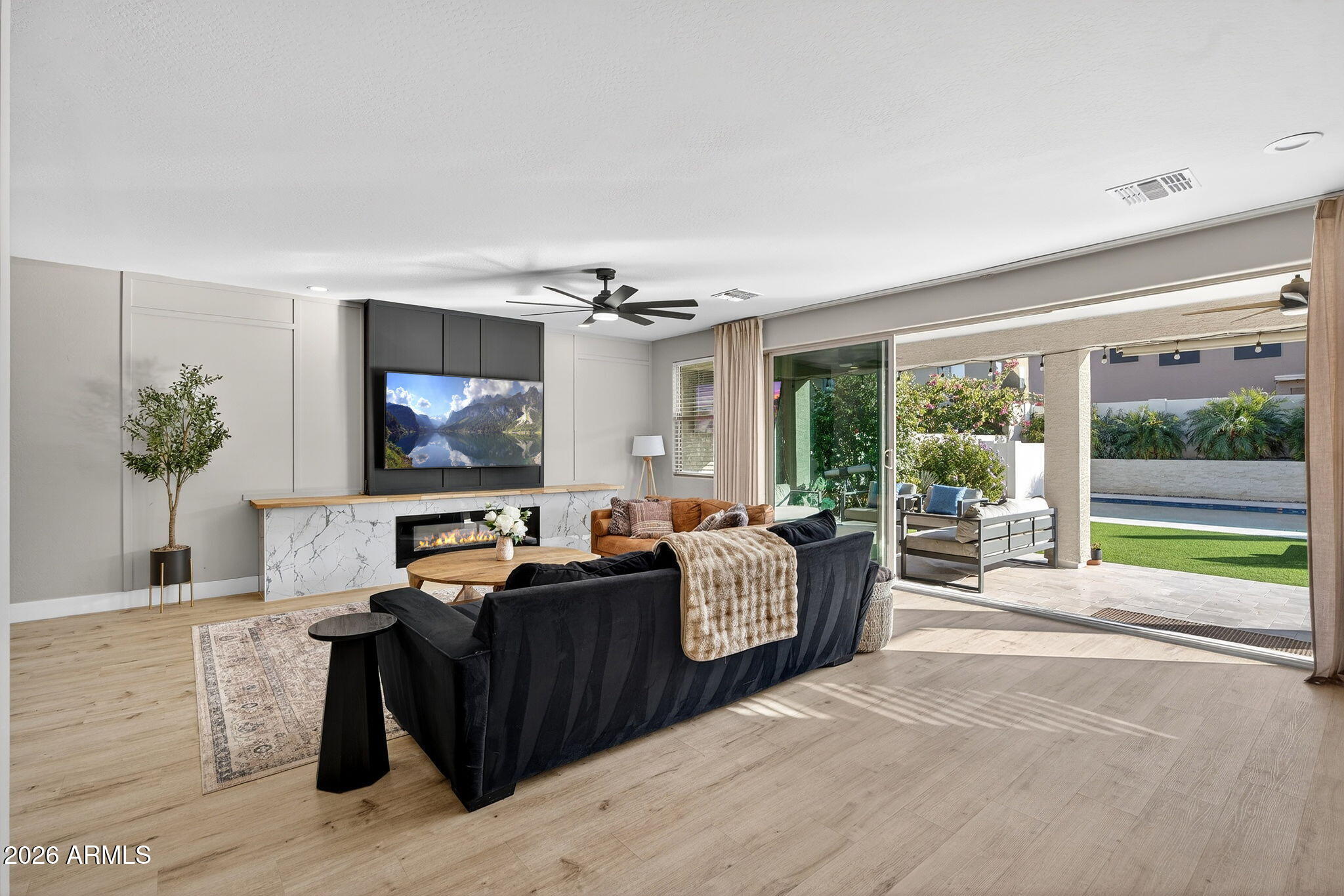 1663 West Gordon Street San Tan Valley, AZ 85144 - Photo 8 of 54 a living room with furniture and a flat screen tv