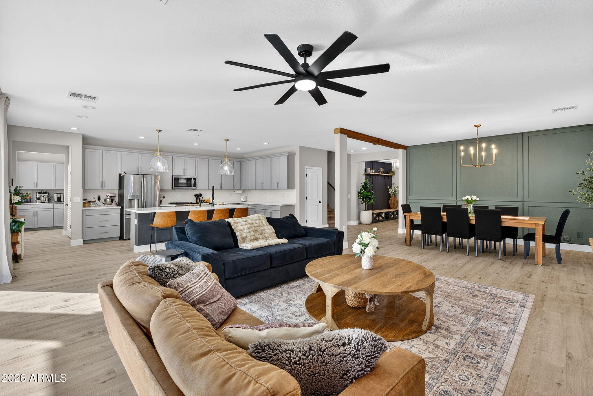1663 West Gordon Street San Tan Valley, AZ 85144 - Photo 9 of 54 a living room with furniture kitchen view and a chandelier