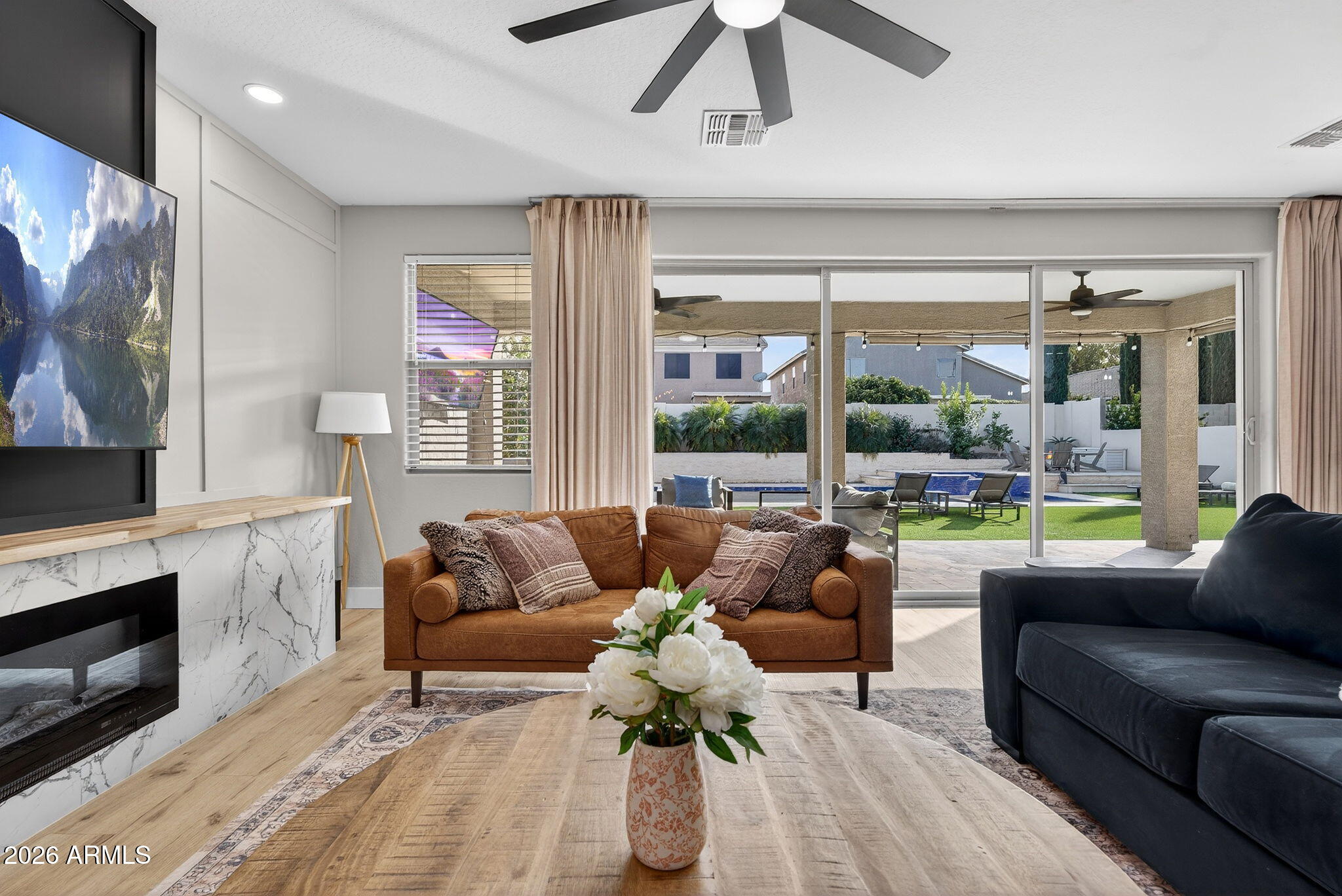 1663 West Gordon Street San Tan Valley, AZ 85144 - Photo 11 of 54 a living room with furniture and a fireplace