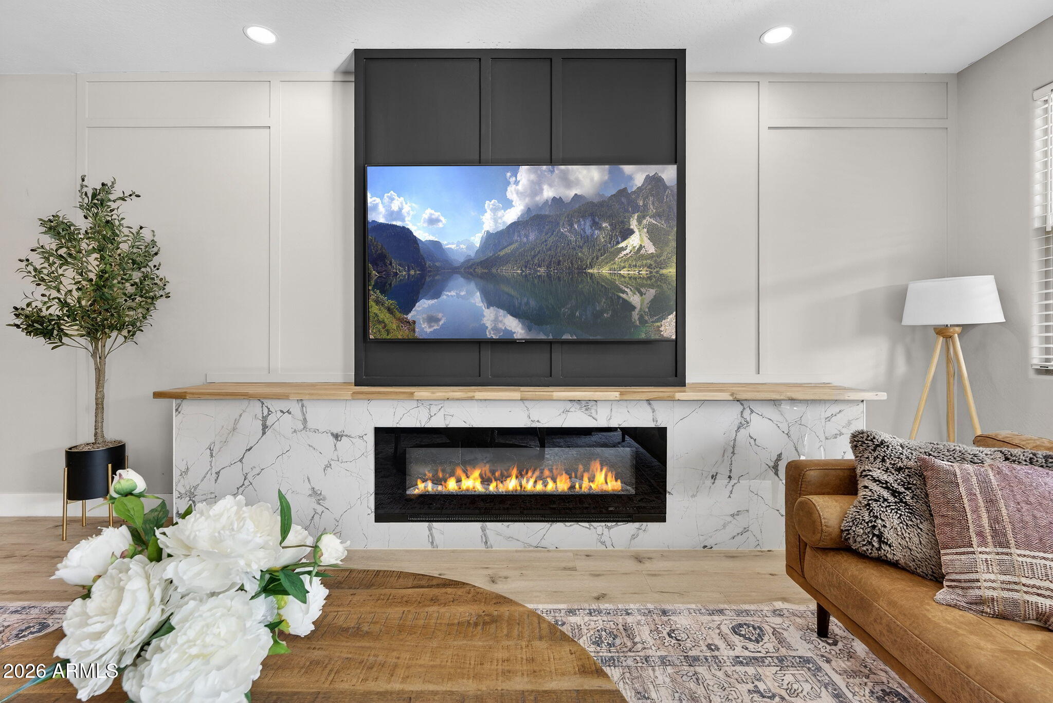 1663 West Gordon Street San Tan Valley, AZ 85144 - Photo 12 of 54 a living room with furniture and a fireplace