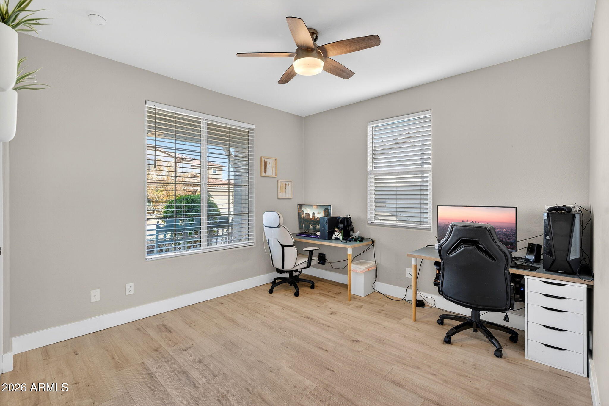 1663 West Gordon Street San Tan Valley, AZ 85144 - Photo 21 of 54 a view of a workspace with furniture and a window