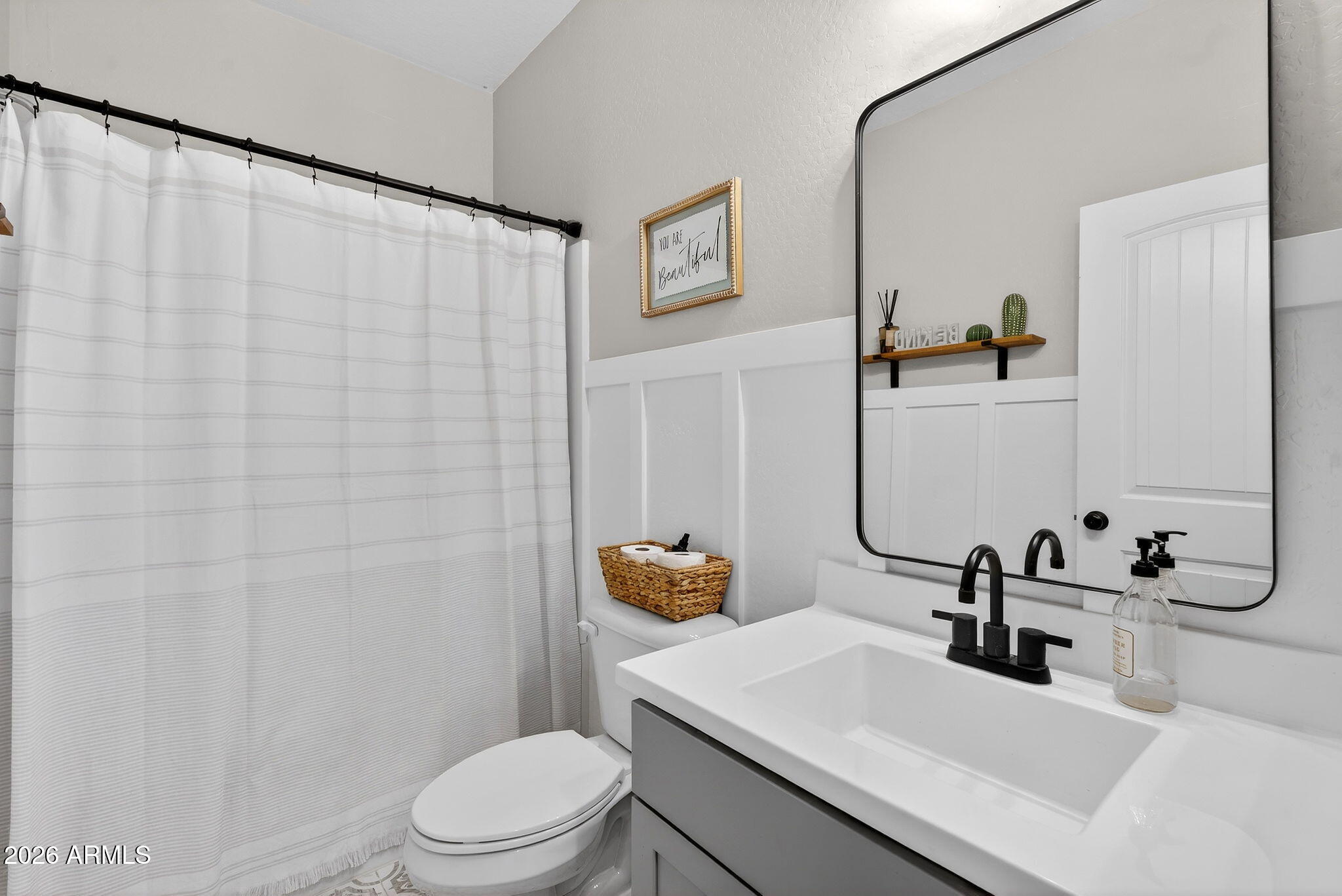 1663 West Gordon Street San Tan Valley, AZ 85144 - Photo 23 of 54 a bathroom with a sink vanity mirror and toilet