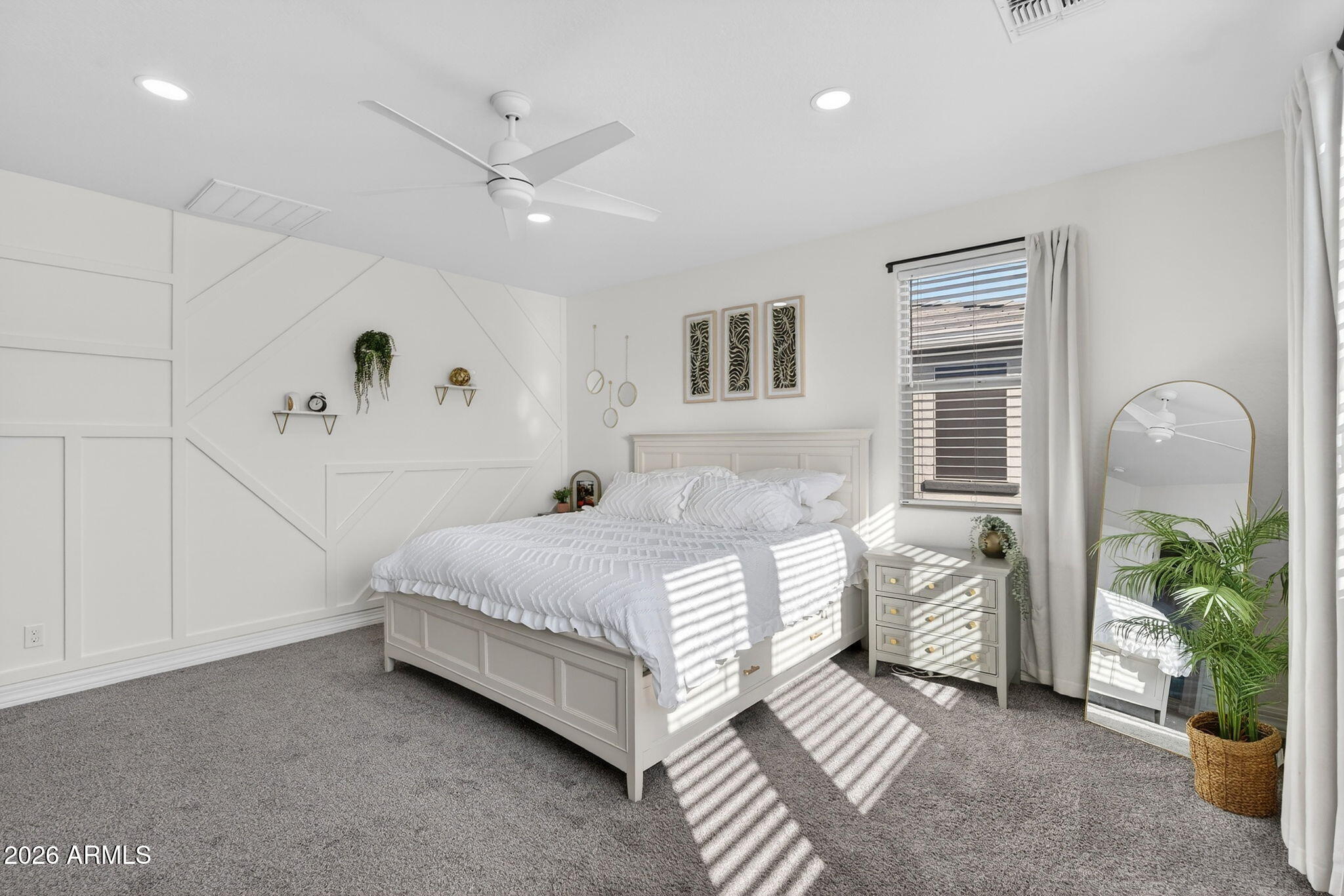 1663 West Gordon Street San Tan Valley, AZ 85144 - Photo 25 of 54 a bedroom with a bed and a potted plant