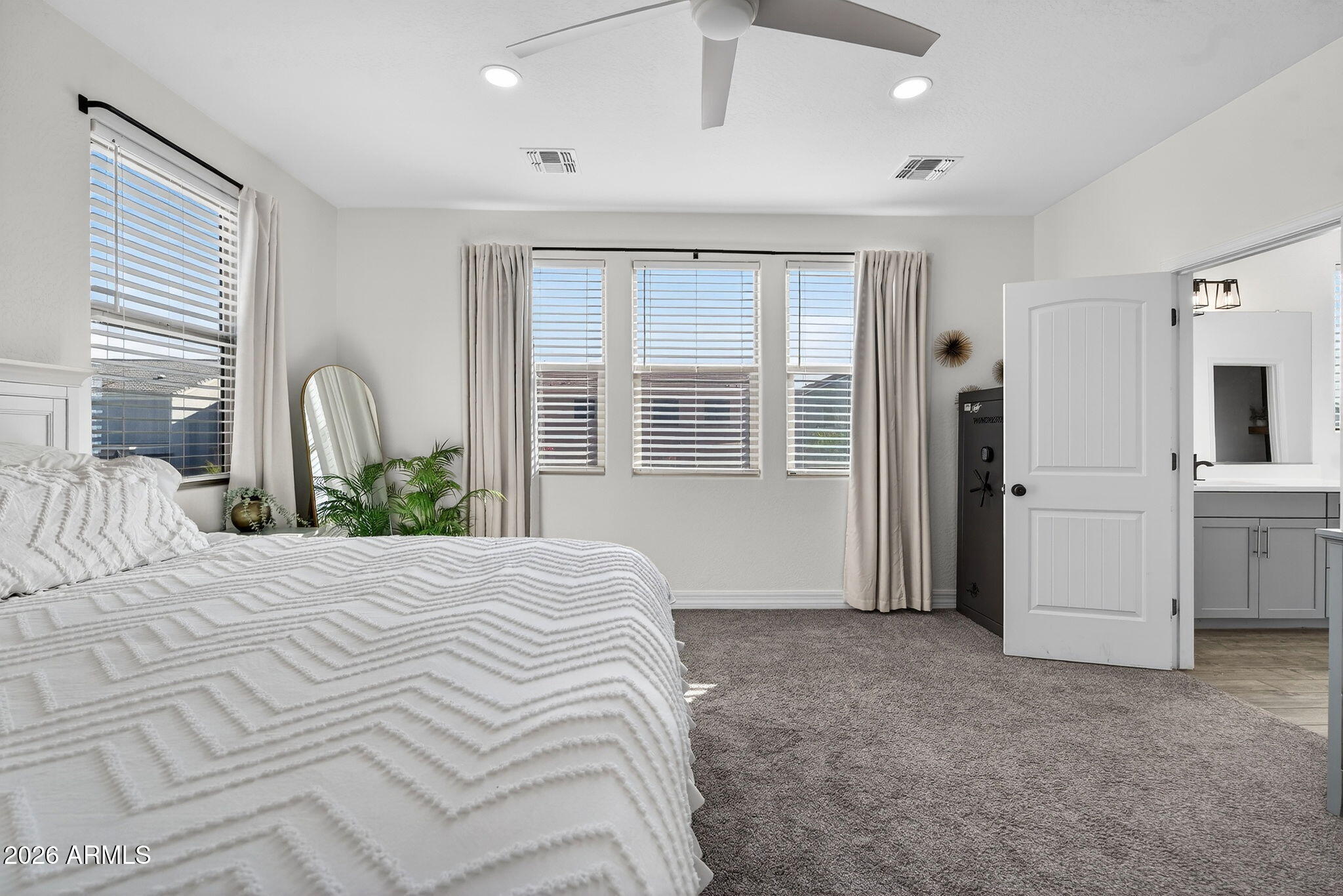 1663 West Gordon Street San Tan Valley, AZ 85144 - Photo 26 of 54 a bedroom with a bed next to a window