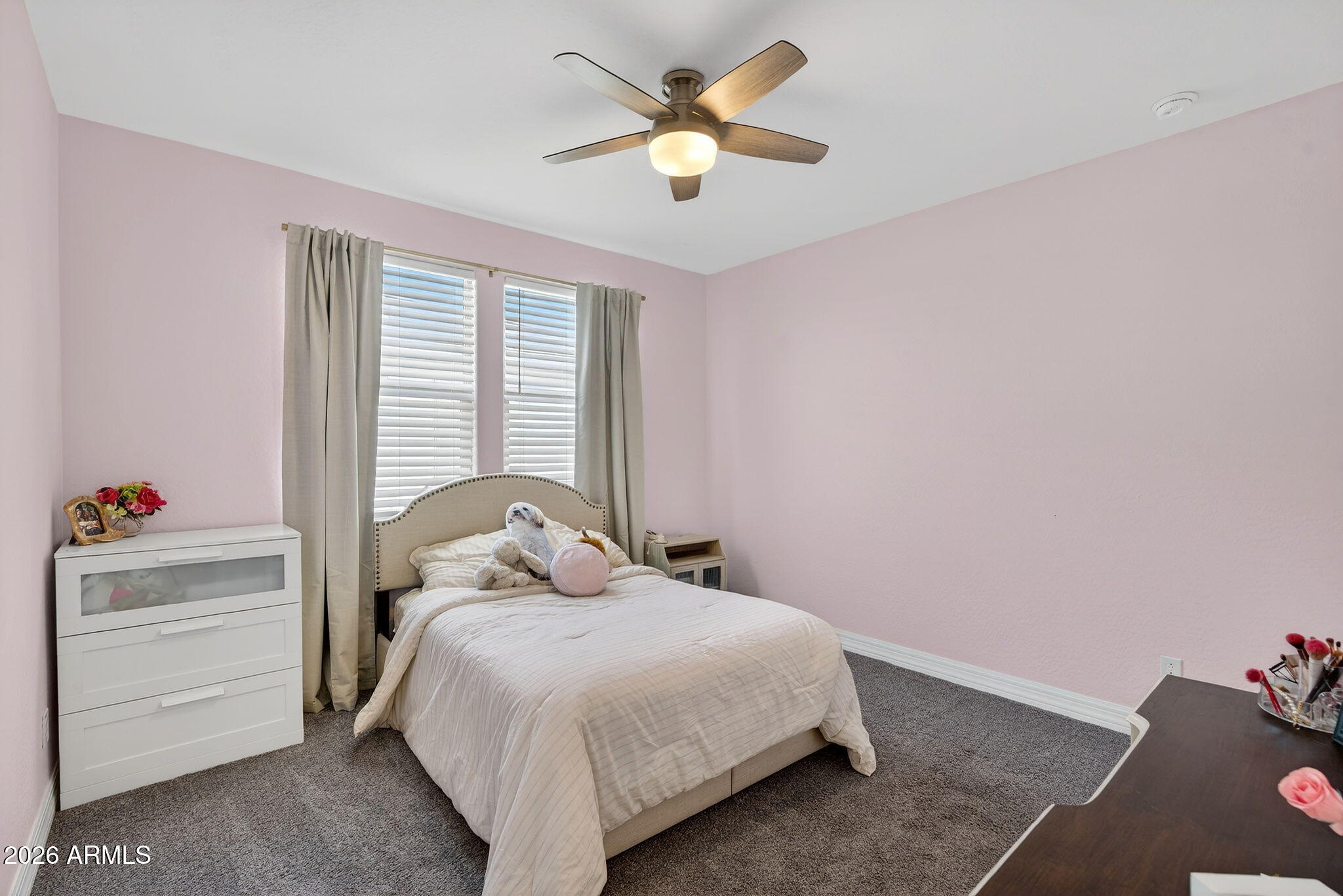 1663 West Gordon Street San Tan Valley, AZ 85144 - Photo 30 of 54 a bedroom with a bed and a chandelier fan
