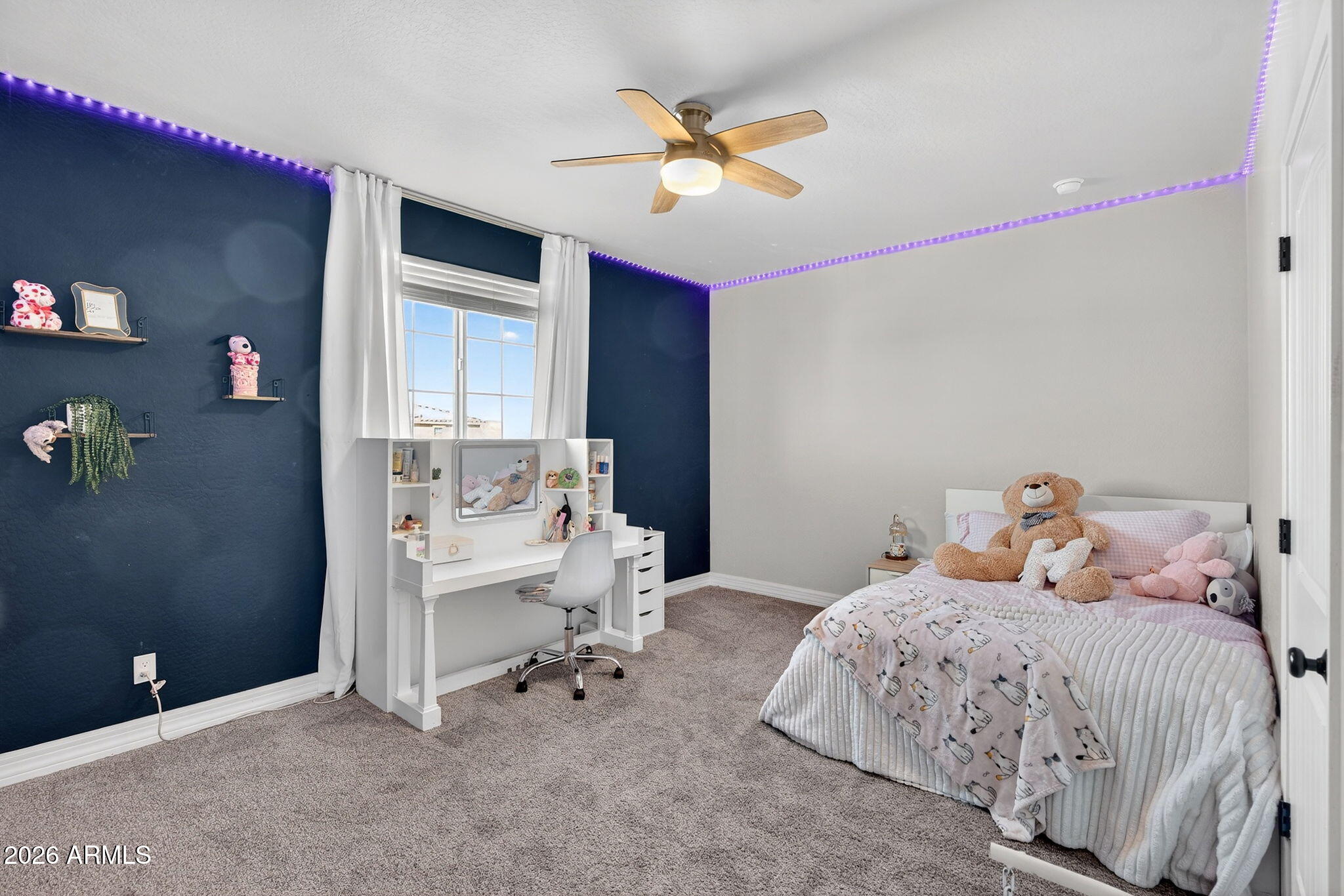 1663 West Gordon Street San Tan Valley, AZ 85144 - Photo 35 of 54 a bedroom with a bed and a table in it